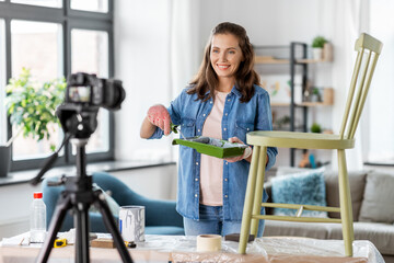 blogging, furniture restoration and home improvement concept - happy smiling woman or blogger with...