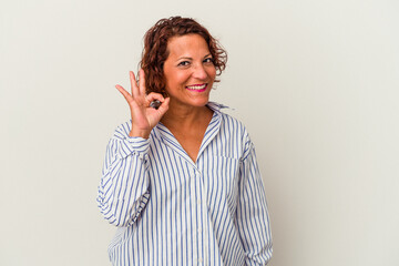 Middle age latin woman isolated on white background cheerful and confident showing ok gesture.