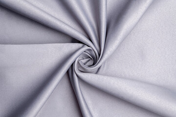 Background, texture. Template. Satin cloth for wedding and evening dresses. A nude shade.