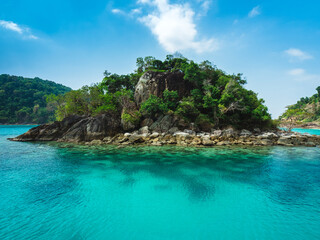 Ko Rang Island. Scenic rocky island, crystal clear turquoise seawater with coral reef. Beautiful snorkeling spot in Mu Koh Chang National Park, Trat, Thailand.