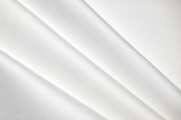Obraz premium Background, texture. Template. Satin cloth for wedding and evening dresses. A nude shade.