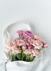 Pink roses on a white background. Postcard for congratulations. Flowers for the background.