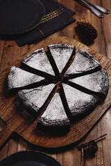 Kladdkaka. Traditional Swedish moist chocolate cake on wooden table. Fika. Hygge. Winter treat - 470652518