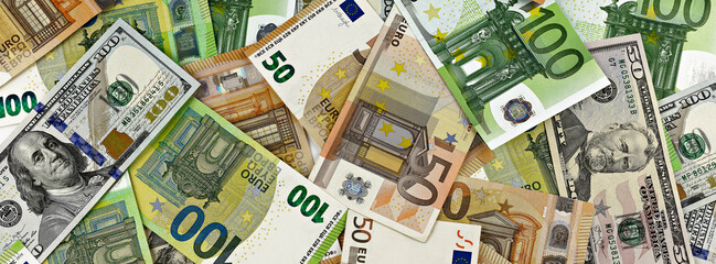 Obraz na płótnie Canvas dollar and euro bills banner. business and financial concept. top view money background