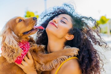 beautiful mixrd race woman with make up and curly hair style spending happy times with her cite...