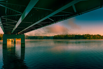 Sunrise over the foggy lake