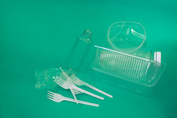 a pile of transparent plastic trash on a blue background