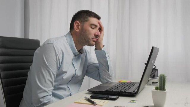 Exhausted Man fell asleep at his office desk from fatigue, then he wake up, Home working 