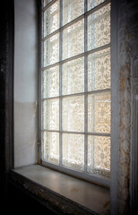 Side view of old window with textured glass