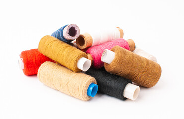 Threads of Warm shades on a white background.