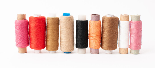 Threads of Warm shades on a white background.