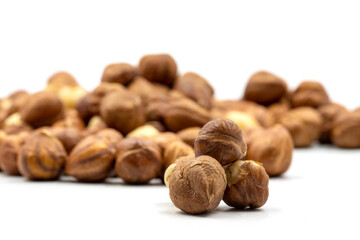 Hazelnut kernel on white background. Snack fresh Peeled hazelnuts. close up