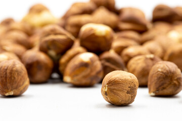 Hazelnut kernel on white background. Snack fresh Peeled hazelnuts. close up