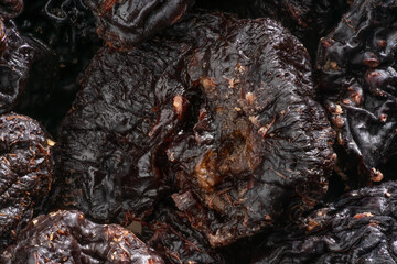 Detailed and large close up shot of dried plums.