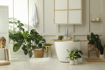 Fototapeta na wymiar Stylish bathroom interior with green plants. Home design
