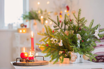 christmas home decorations with candles in red and white colors