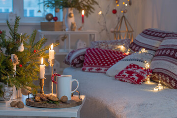 christmas home decorations with candles in red and white colors