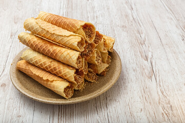 Homemade waffles with caramel. Wooden background. Copy space. Photo