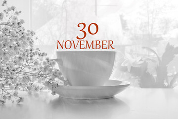 calendar date on light background with porcelain white tea pair and white gypsophila with copy space. November 30 is the thirtieth day of the month