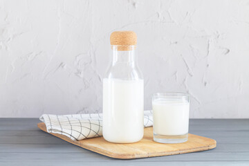 Glass jar with cork of yogurt, kefir, buttermilk