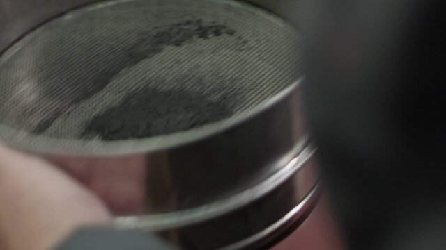 Iron ore is sifted through a sieve