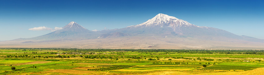 Panorama of Ararat mountain and farmland in the valley. Travel and nature background in Armenia