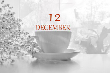 calendar date on light background with porcelain white tea pair and white gypsophila with copy...