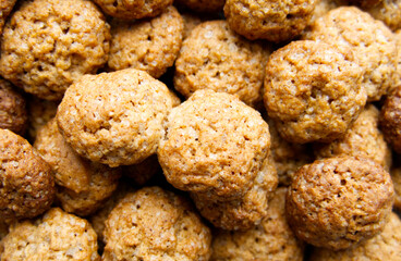 Close-up of a heap of home-made Dutch "Kruidnoten", small spiced biscuits or cookies enjoyed in the run up to and around the festival of Sinterklaas (Saint Nicholas) on 5-6 December