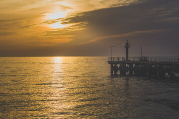 Fototapeta na wymiar view of the sea pier at sunset