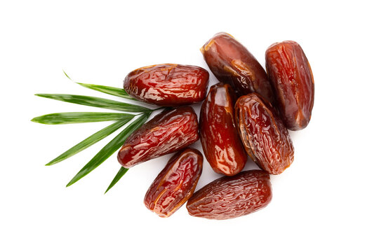 Dry dates isolated on white background. Top view. Flat lay pattern.