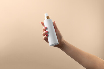 Women holding cosmetics bottle, branding mockup template, real photo, dropper, tube, blank isolated on a beige background to place your design.