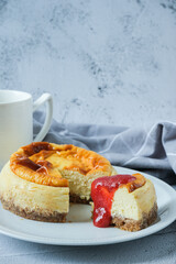 New York Cheesecake with strawberries sauce and white background