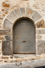 Stone wall with old entrance and one old blind