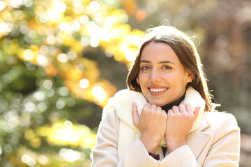 Happy woman warmly clothed in a park