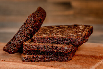 Multi-grain black bread on a wooden board