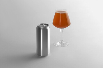 Blank beer can and glass with beer on a white background, craft beer mockup templates, with empty...