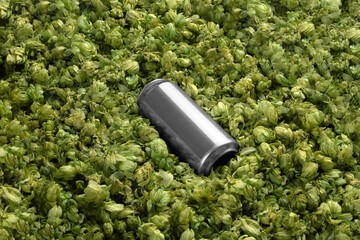 Blank beer can on the green hops background, craft beer mockup templates, with empty space to place your label or design