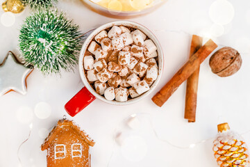 Christmas background with cocoa mug with marshmallows and Christmas items on a white background....