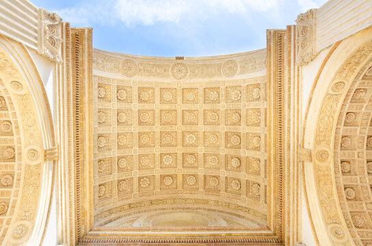 An architectural element of the beautiful vault of an antique stone arch. Bottom view