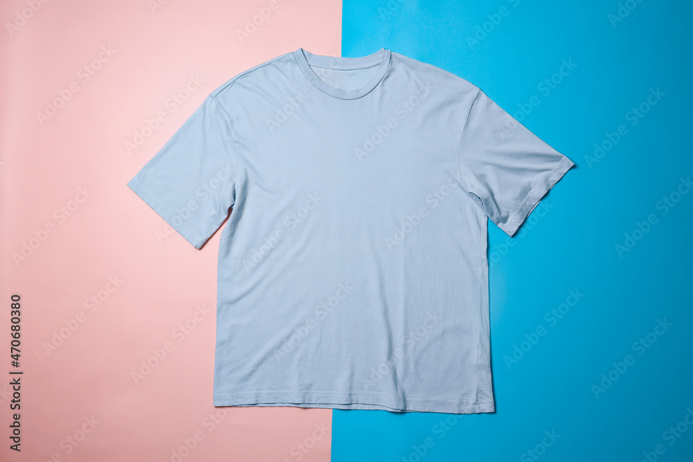 Wall mural Blue t-shirt mockup on colorful background. Flat lay tee template - Wall murals