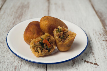 Combro, popular street food originally from West Java. Combro is an abbreviation from Oncom di jero...