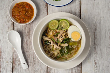 Chicken Soto or Soto Ayam in Indonesia. Soto ayam is a traditional Indonesian dish which uses ingredients such as chicken, vermicelli, bean sprout with turmeric as main ingredient add in the broth.