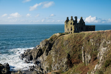 Fototapeta na wymiar Dunskey Castle on rocky coastline, Portpatrick, Dumfries and Galloway, Scotland, United Kingdom, Europe