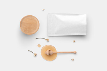 Blank tea bag packaging mockup, with honey, spoon, camomilla, top view, packaging mockup with empty...