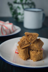 Enting-enting gepuk, traditional sweets from Salatiga, East Java, Indonesia. A sugary peanut mold into triangle shape