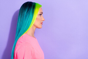 Profile side photo of millennial blue teal different color haired lady look empty space isolated over violet color background