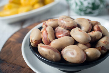 Boiled or steamed jack fruit seed, traditional healthy snack for tea or coffee time with rustic...