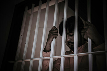 Hands of men desperate to catch the iron prison,prisoner concept,thailand people,Hope to be free.