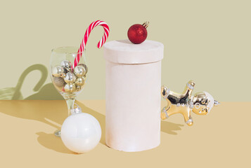 Christmas and New Year holidays concept, decorations, gingerbread on pedestal. Christmas, New Year  greeting card. Gold background.