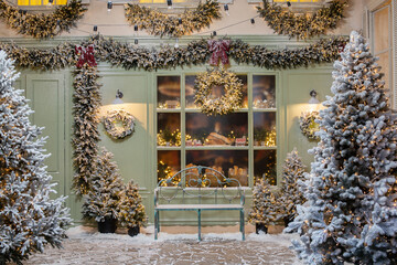 New Year's photo zone with snow near a cafe bakery.
Christmas decor: toys, Christmas trees, bench,...